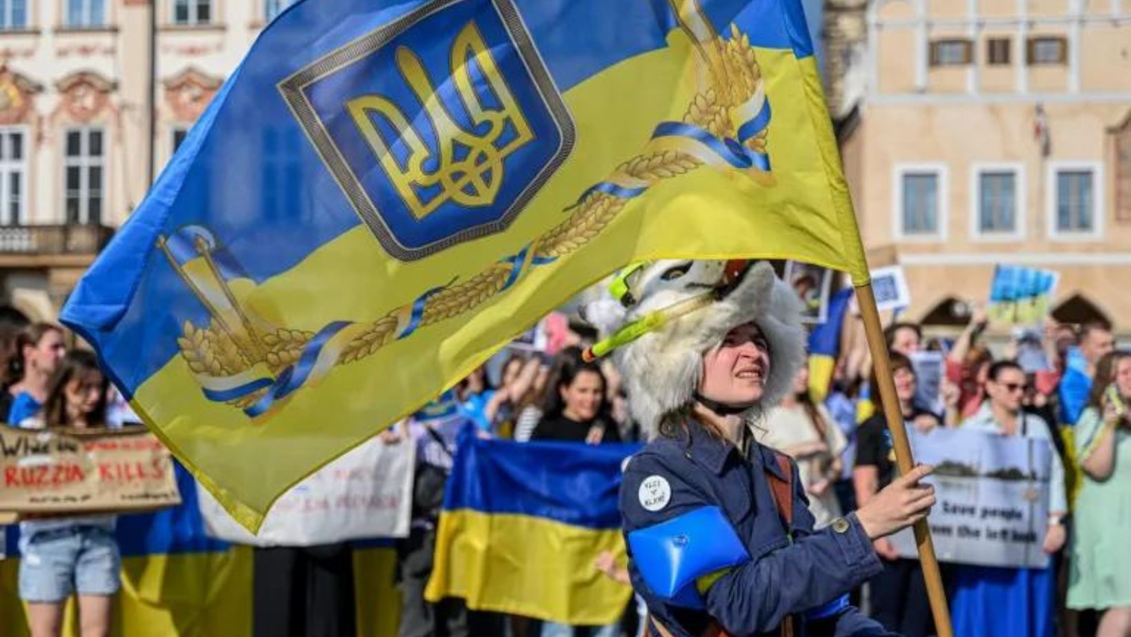 Ukrainian refugees gather in Prague's Old Town Square.